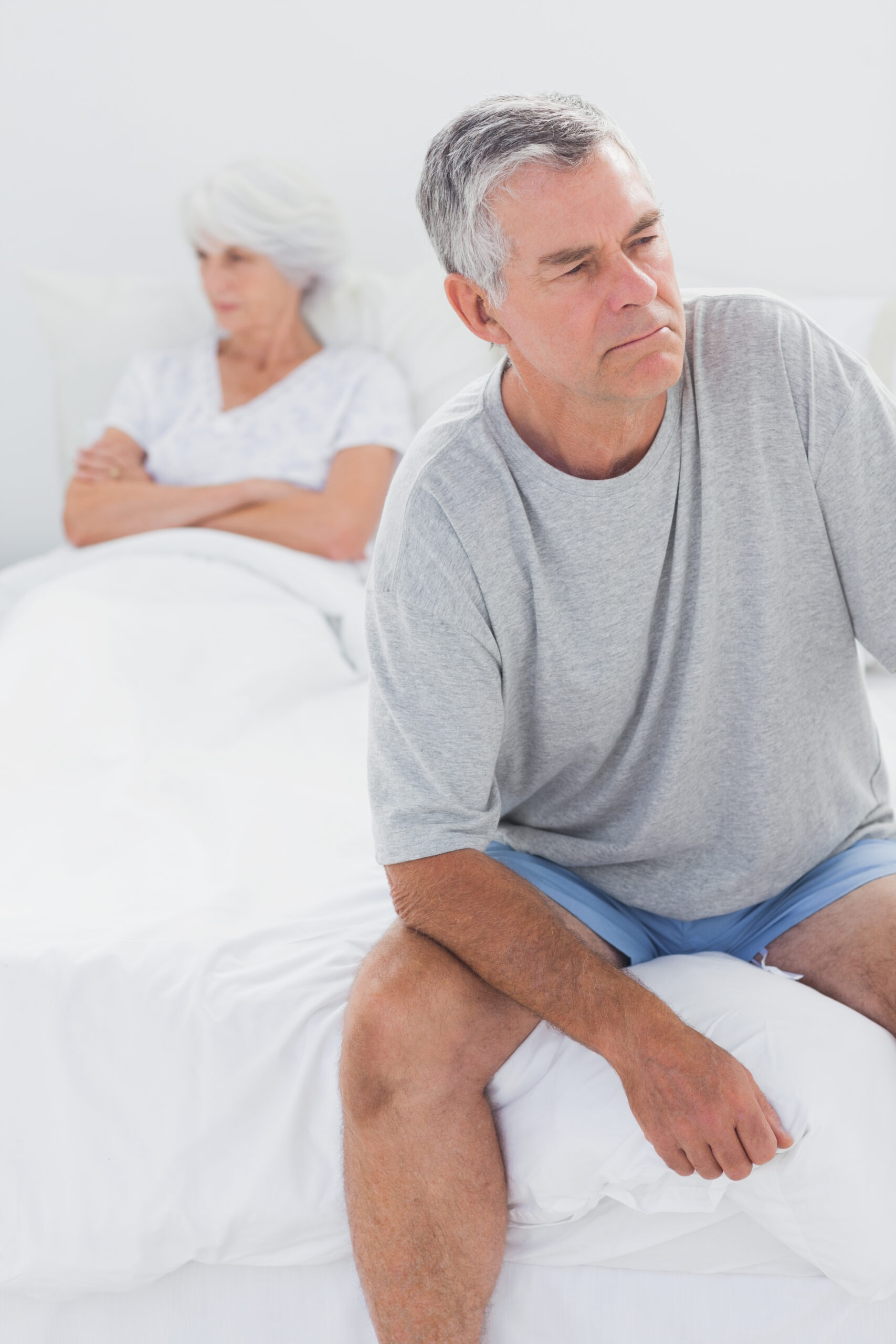 upset-man-sitting-bed-dispute-scaled.jpg